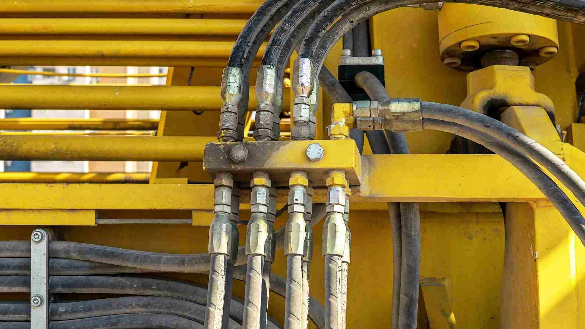 Close up of hydraulic hoses on a piece of heavy machinery